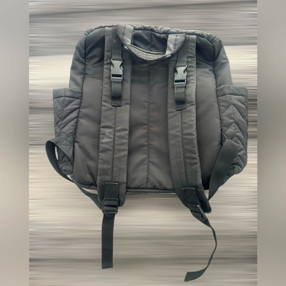 Skip Hop Forma Diaper Backpack. Black Exterior with Teal Interior.